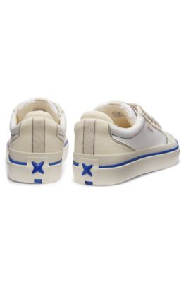 Low-top trainers with blue-line outsole, White