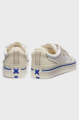 Low-top trainers with blue-line outsole, White