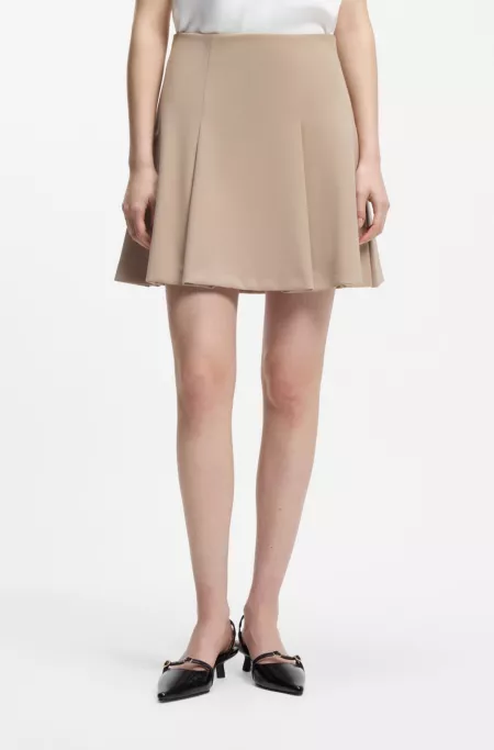 Minifalda acampanada con pliegues