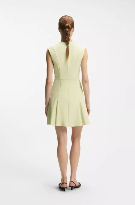 Sleeveless dress with gold-tone flower brooch