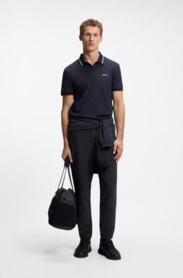 Pantalon en tissu stretch gaufr&eacute; avec fermeture &eacute;clair encadr&eacute;e et cordon de serrage, Bleu fonc&eacute;