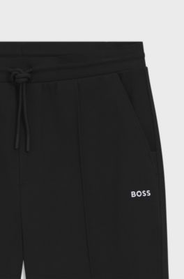 Cotton-blend tracksuit bottoms with pintuck pleats, Black