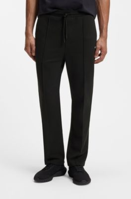 Cotton-blend tracksuit bottoms with pintuck pleats, Black