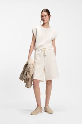 Sleeveless loose-fit sweatshirt with V-cut hemline, Natural