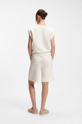 Sleeveless loose-fit sweatshirt with V-cut hemline, Natural