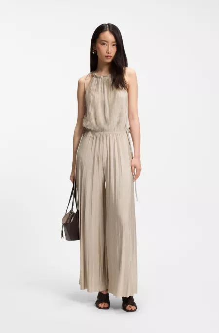 Halterneck jumpsuit in lustrous jersey with plissé pleats