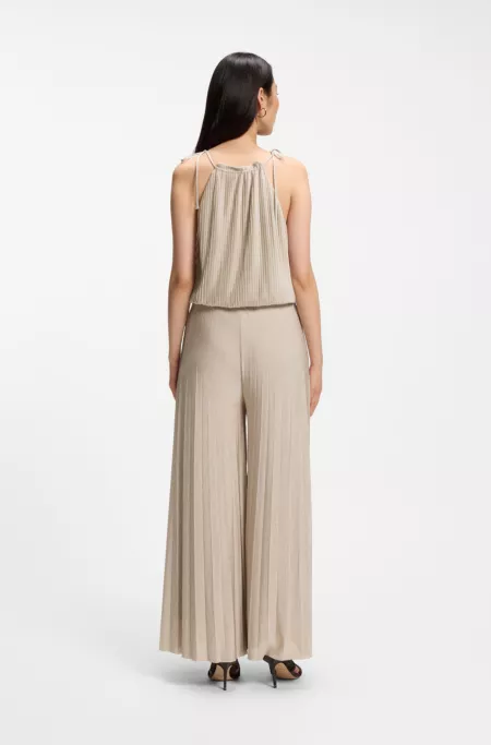 Halterneck jumpsuit in lustrous jersey with plissé pleats