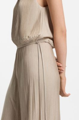 Halterneck jumpsuit in lustrous jersey with pliss&eacute; pleats, Beige