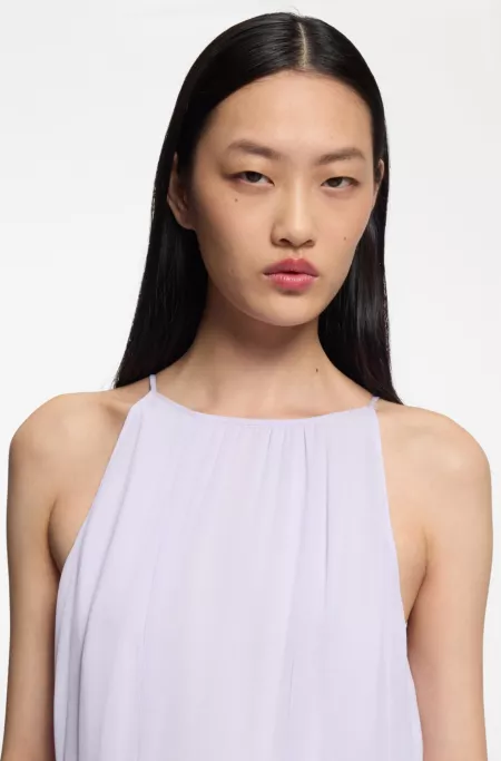 Sleeveless dress with plissé skirt inserts