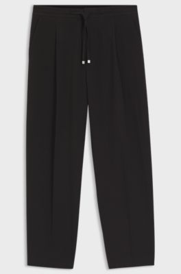 Pantaloni con fit moderno in seersucker di cotone elasticizzato, Nero