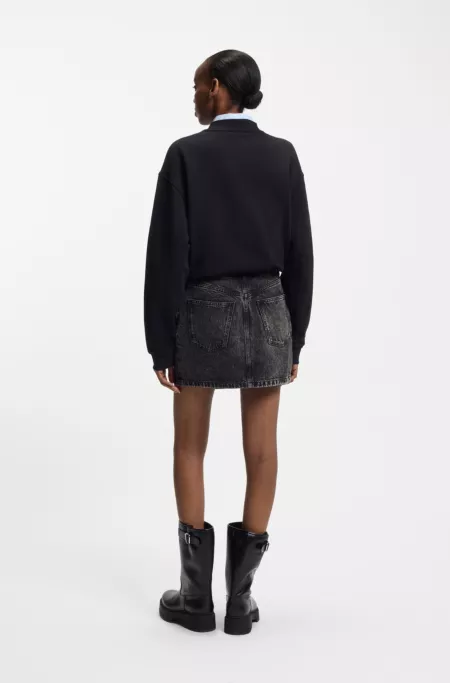 Black-denim skirt with asymmetric waistband