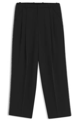 Pleat-front trousers with whipstitch details 1