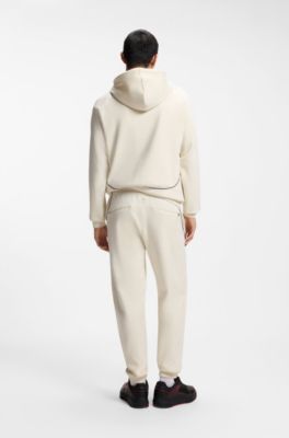 HUGO x RB-trainingsbroek van stretchkatoen met stiermotief, Naturel