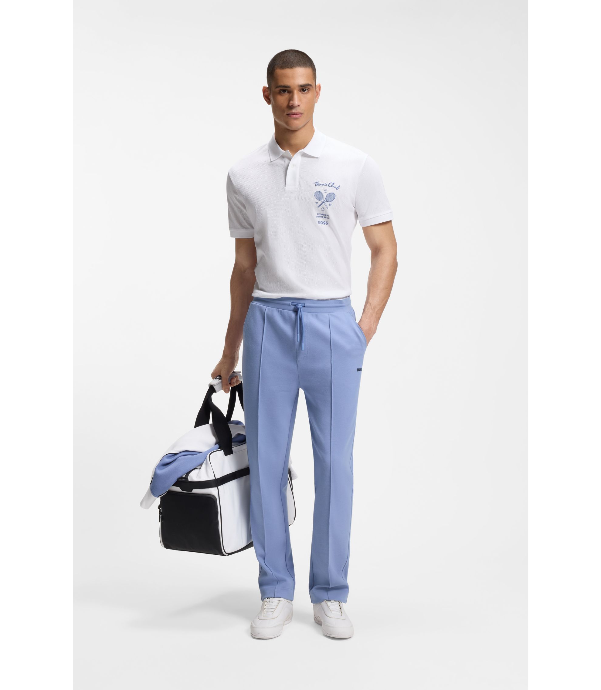 Poloshirt aus Baumwolle in Mesh-Optik mit gesticktem Artwork