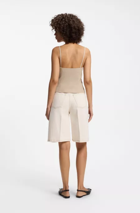 Waistcoat-style slim-fit top with sparkling pinstripe