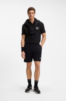 Stretch-cotton polo shirt with tennis-inspired logo, Black