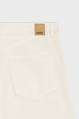 Jeans met wijde pijpen in cr&egrave;mekleurig denim met plooi aan de voorkant, Naturel