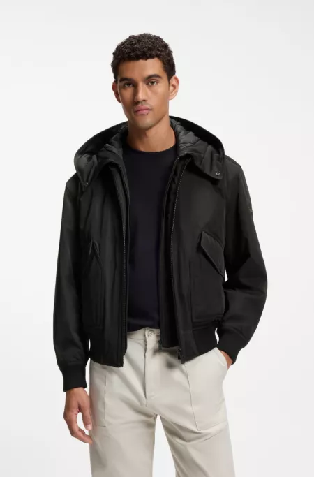 Water-repellent jacket with detachable hooded bib
