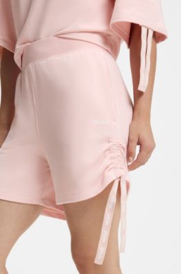 Logo-print shorts with gathered sides, light pink