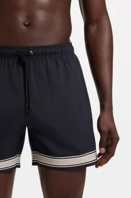 Drawstring swim shorts in stretch fabric with tape trim