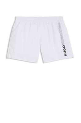 Swim shorts with repeat logos 1