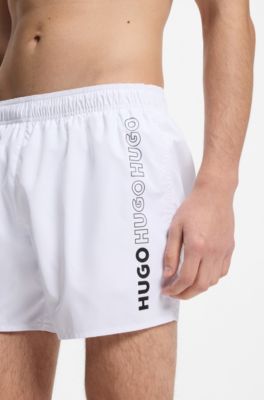 Swim shorts with repeat logos, White