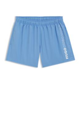 Swim shorts with repeat logos 1