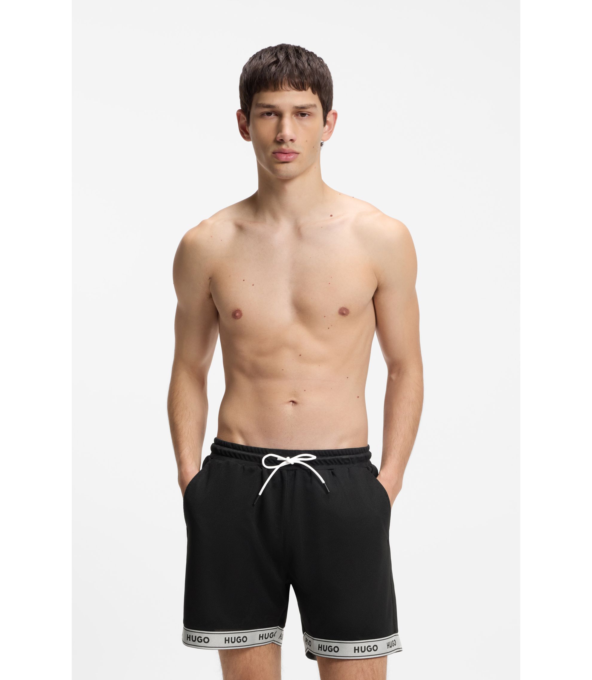 Badeshorts aus Mesh mit Jacquard-Logo-Tape