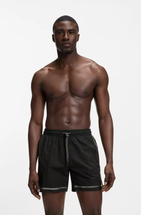 Swim shorts with logo stripe print