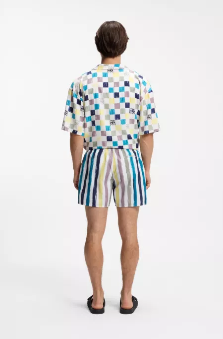 Stripe-print swim shorts in quick-dry fabric