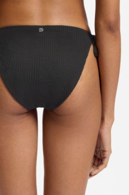 Tie-side bikini bottoms with structured tropical pattern, Black