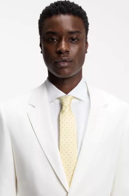 Italian-made tie in silk with jacquard-woven dots