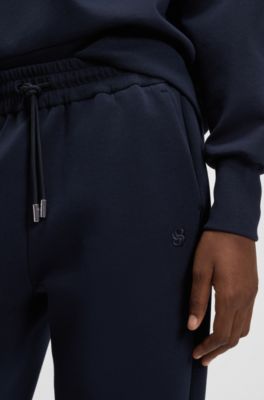 Relaxed-fit cotton-blend cuffed tracksuit bottoms, Dark Blue