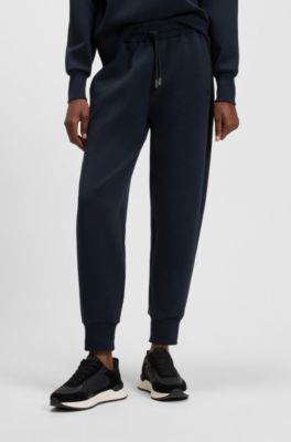 Pantaloni della tuta relaxed fit in misto cotone con fondo gamba elastico, Blu scuro