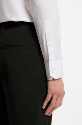 Pantaloni fit affusolato in seersucker di cotone elasticizzato, Nero