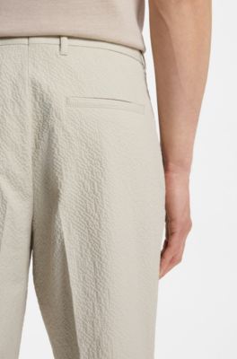 Tapered-fit trousers in stretch-cotton seersucker, Light Beige