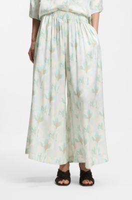 Pantalones oversize fit de pernera ancha con estampado floral, Fantas&iacute;a