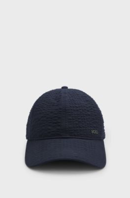 Cappellino in seersucker di cotone elasticizzato con scritta del logo in metallo, Blu scuro