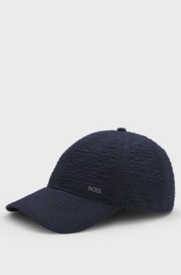 Cappellino in seersucker di cotone elasticizzato con scritta del logo in metallo, Blu scuro
