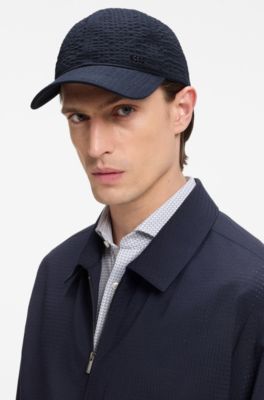Cappellino in seersucker di cotone elasticizzato con scritta del logo in metallo, Blu scuro