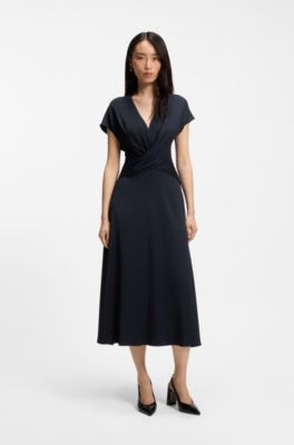 Kleid aus Stretch-Gewebe in Wickeloptik, Dunkelblau