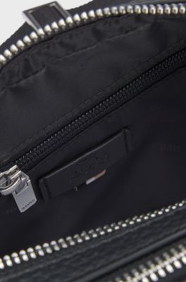 Crossbody bag in grained leather with embossed logo, Black