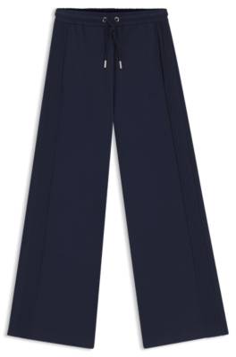 Relaxed-fit tracksuit bottoms with piping details 4