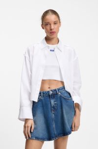 Oversize pinstriped cotton shirt with open cut hem, White