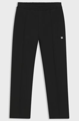 Relaxed-fit tracksuit bottoms in a structured cotton blend, Black