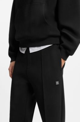 Relaxed-fit tracksuit bottoms in a structured cotton blend, Black