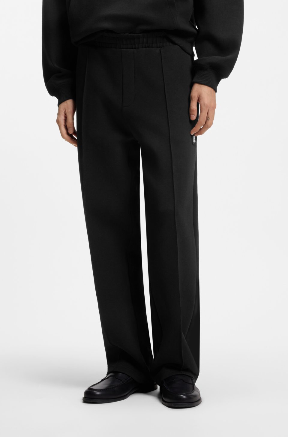 Relaxed-fit tracksuit bottoms in a structured cotton blend