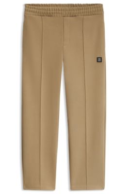 Relaxed-fit tracksuit bottoms in a structured cotton blend, Beige
