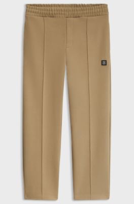 Relaxed-fit tracksuit bottoms in a structured cotton blend, Beige