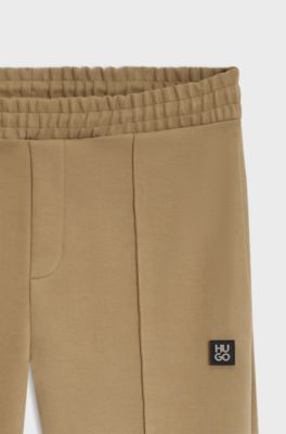 Relaxed-fit tracksuit bottoms in a structured cotton blend, Beige